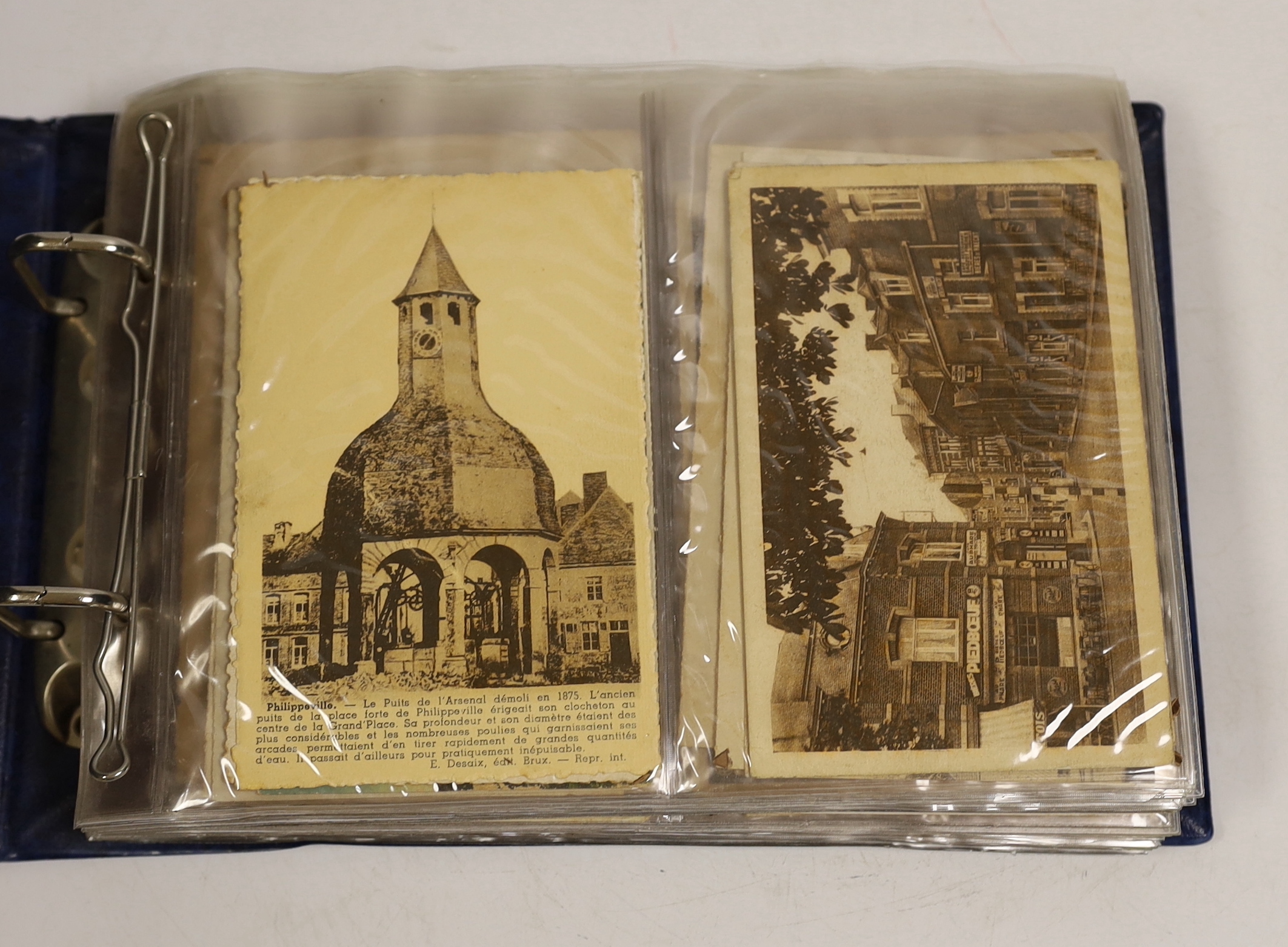 A postcard album, largely continental topography, and eight cards relating to car and motorcycle racing